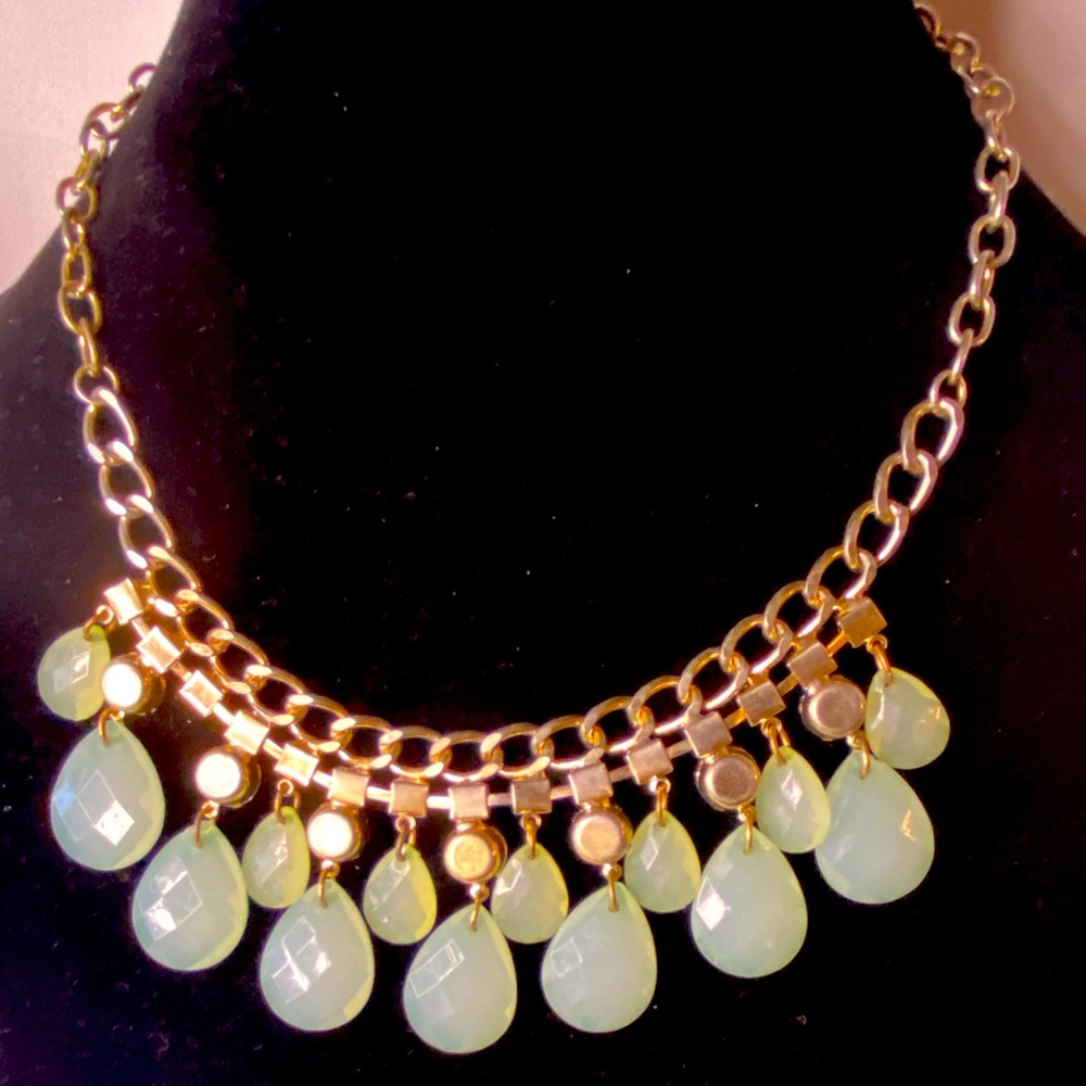Pretty light green necklace with white stones, golden color$16